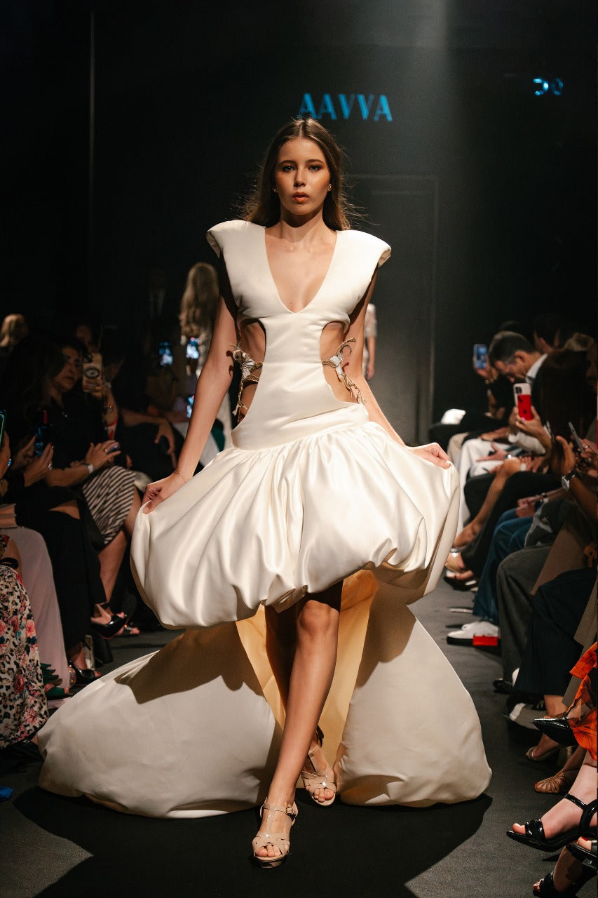 A deep V-neckline, structured shoulders