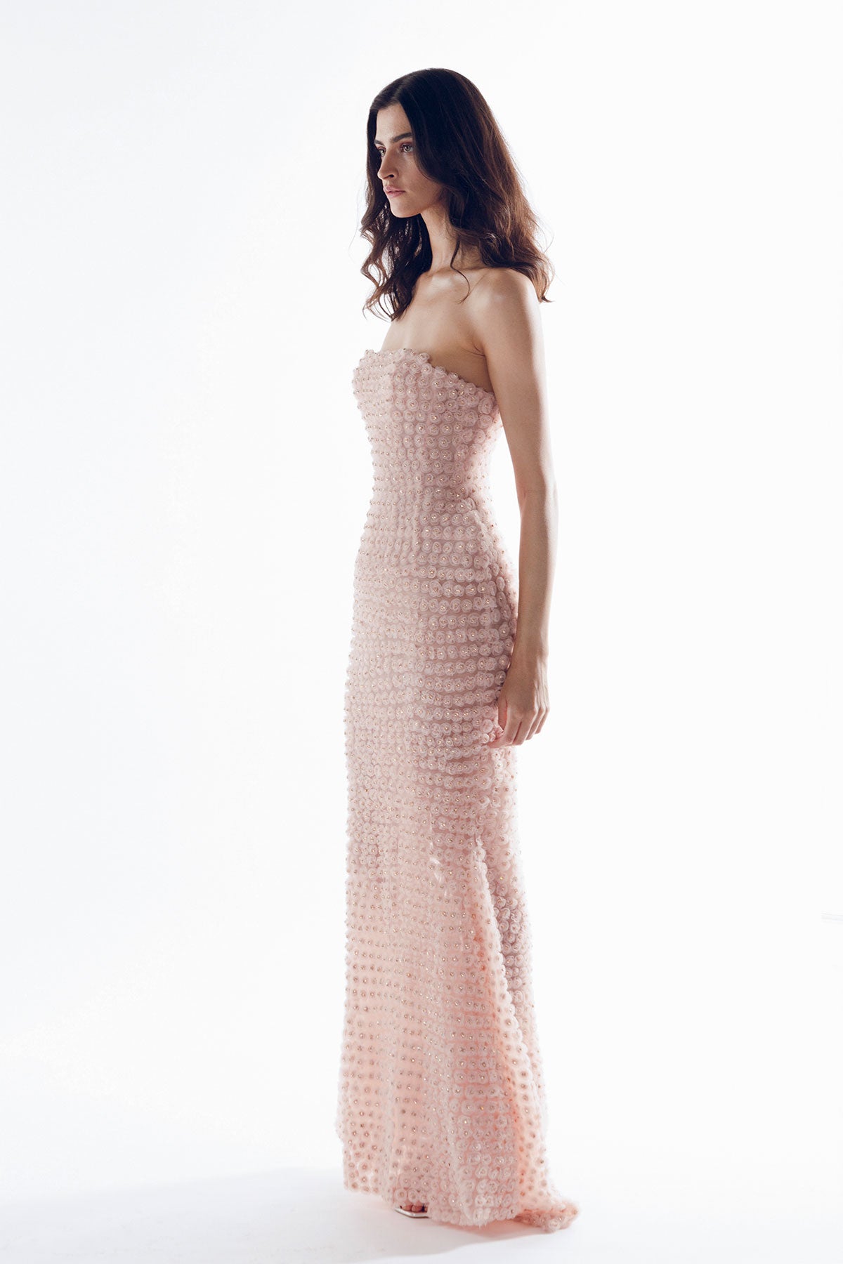 A strapless, form-fitting dress with an exaggerated waistline.