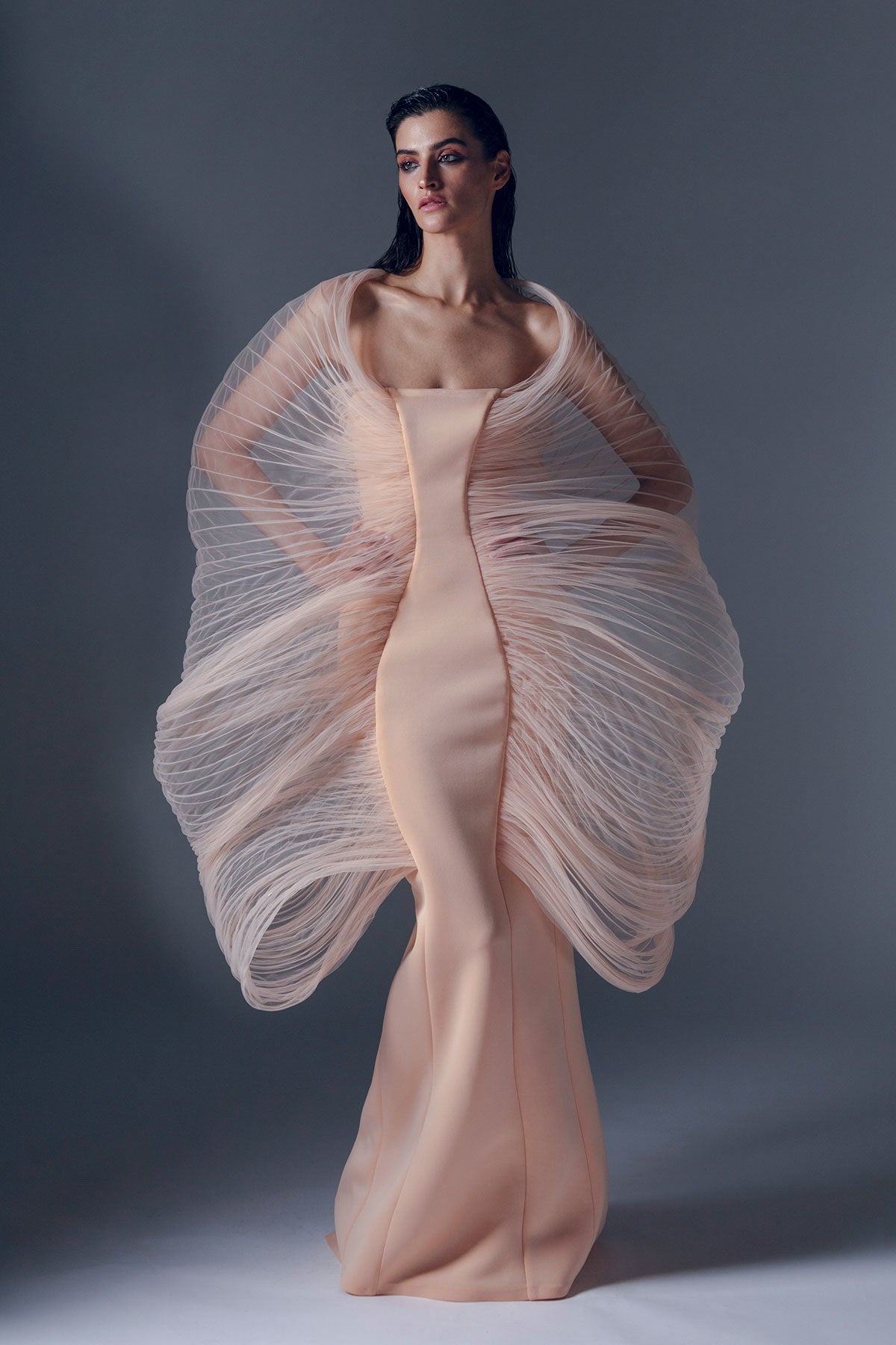 Floor-length dress in a soft cream neoprene fabric.