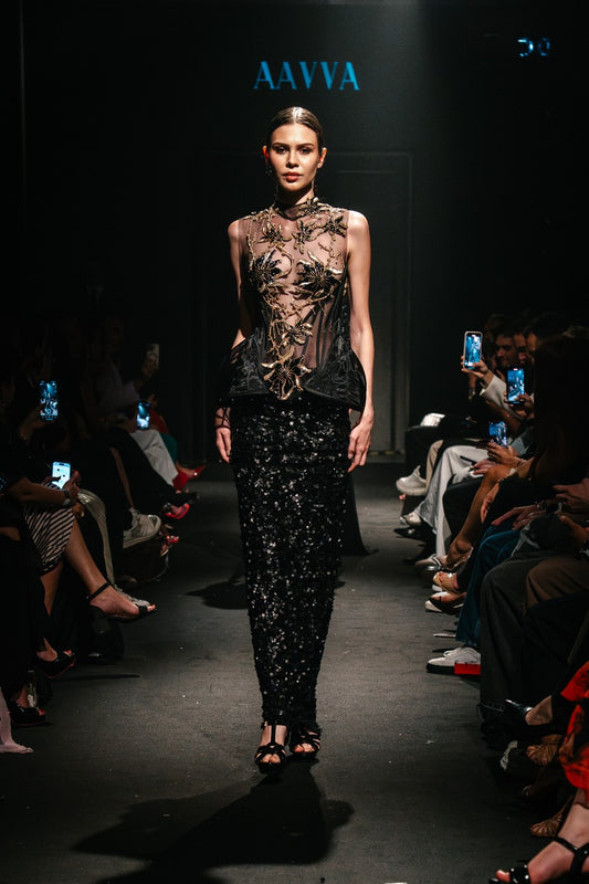 Sheer black top with a high neckline