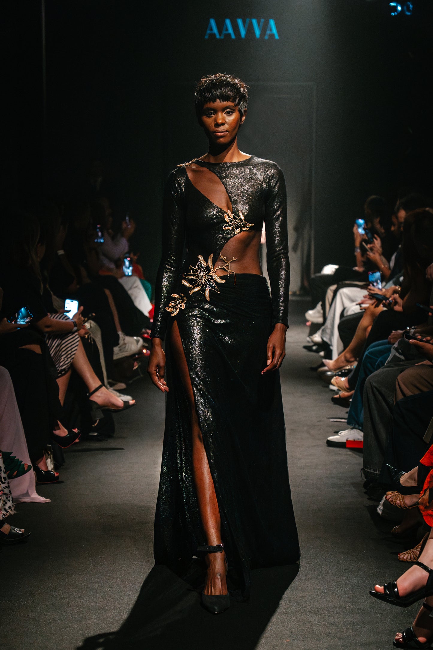 The sleek long sleeves and fitted silhouette black gown