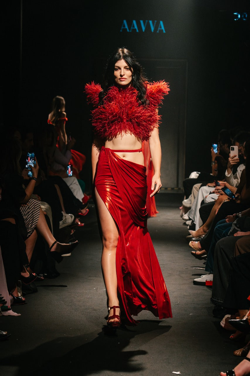 A lavish explosion of crimson feathers, cascading in rich layers to create depth and movement