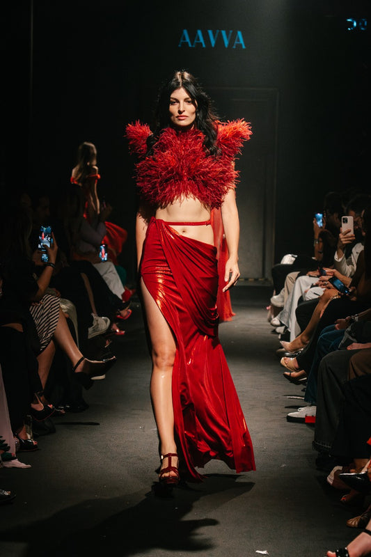 A lavish explosion of crimson feathers, cascading in rich layers to create depth and movement