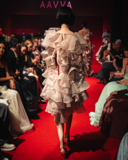 Sleeveless Organza gown with layers of raffles