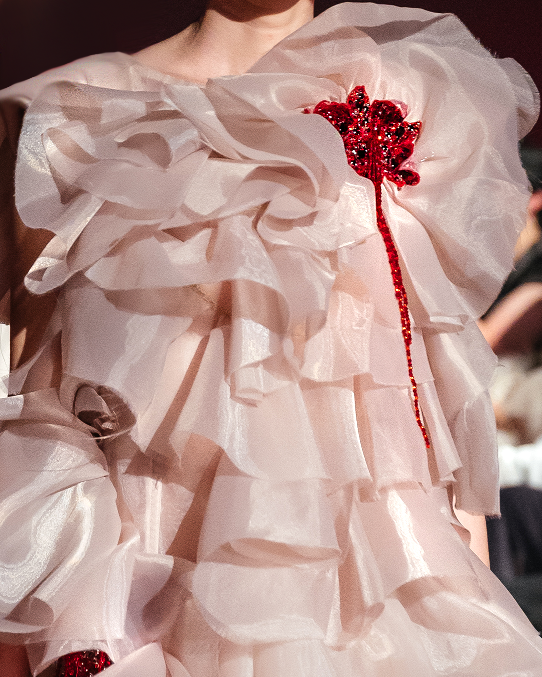 Sleeveless Organza gown with layers of raffles