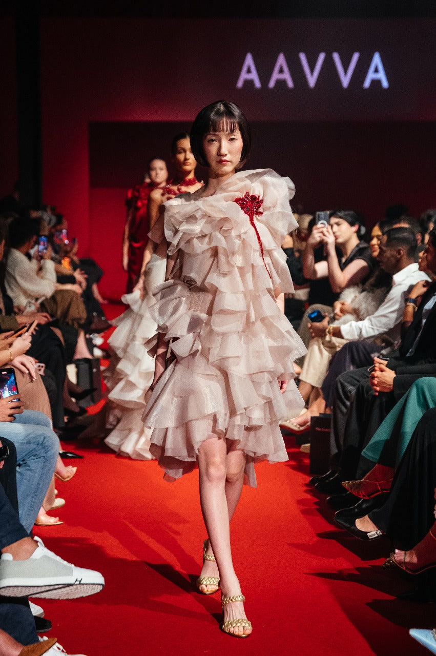 Sleeveless Organza gown with layers of raffles