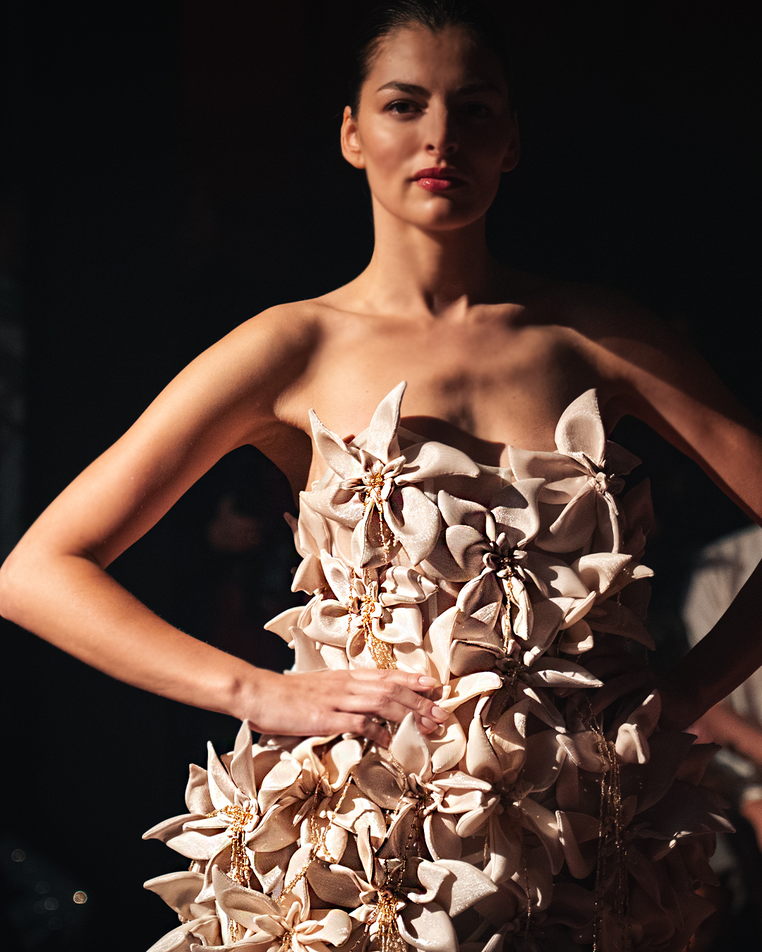 Strapless mermaid gown embellished with fully 3D flowers with fringes