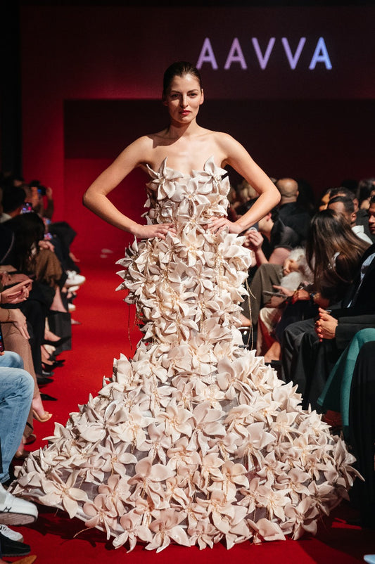 Strapless mermaid gown embellished with fully 3D flowers with fringes