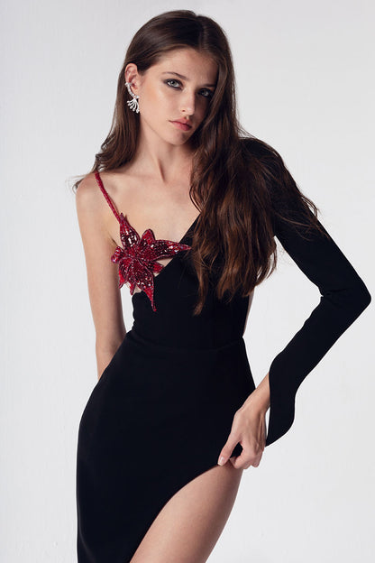 One sleeve black crepe dress with embroidered flower on the chest with metallic red lining