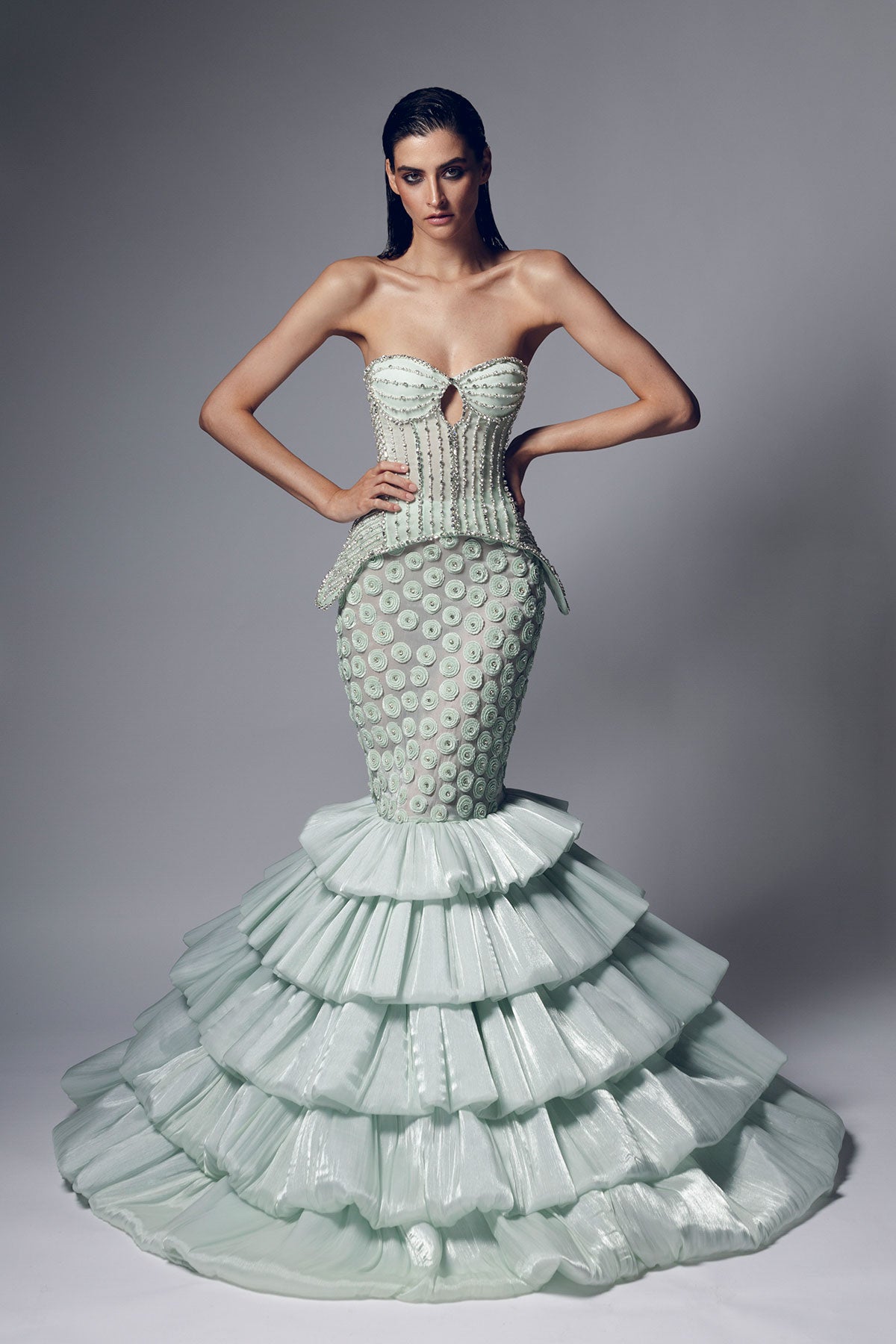 A mint green mermaid silhouette skirt with intricate beadwork