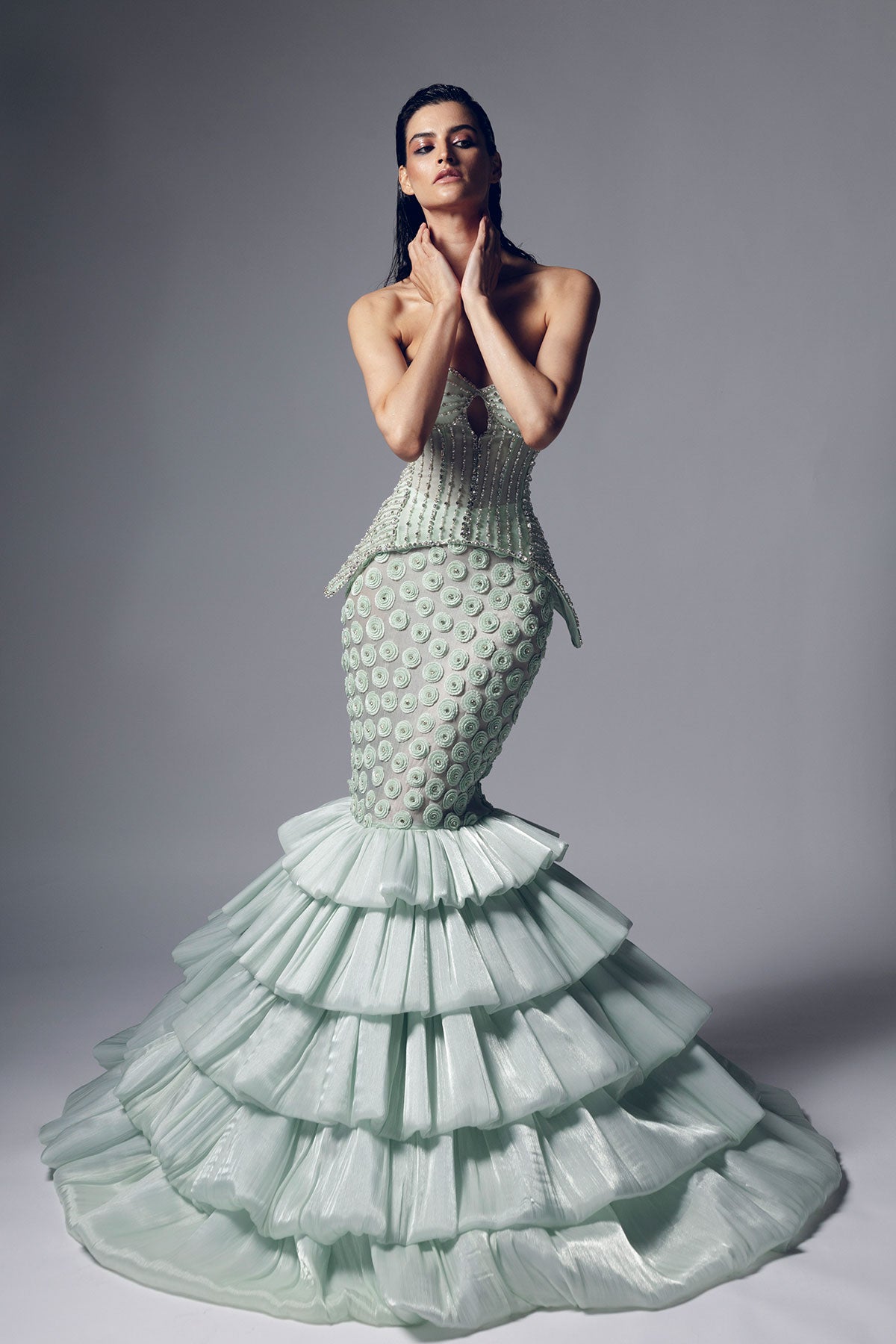 A mint green mermaid silhouette skirt with intricate beadwork